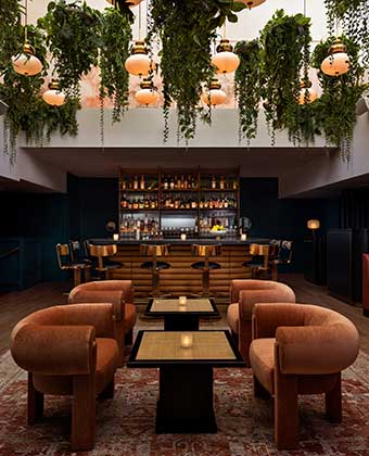 Seating and view of bar at Bar Sprezzatura at Kimpton Theta New York - Times Square